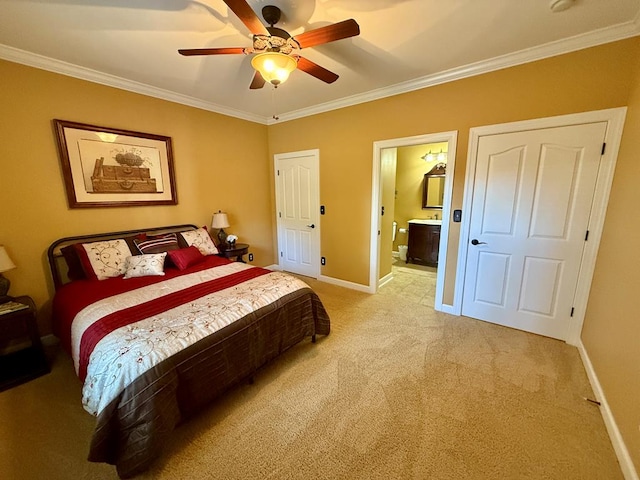 carpeted bedroom with ceiling fan, crown molding, and ensuite bath