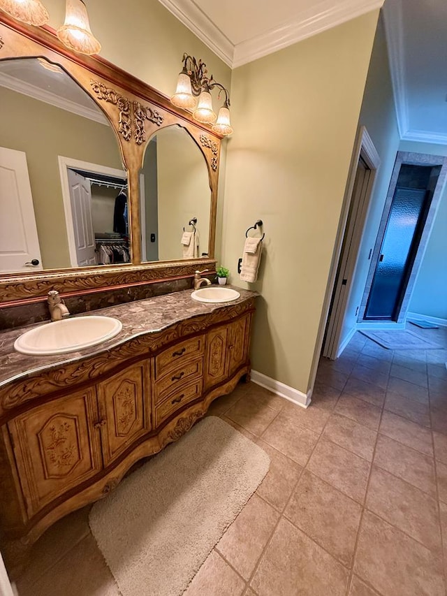 bathroom with tile patterned flooring, vanity, and crown molding