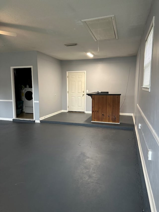 interior space with washer / clothes dryer and baseboards