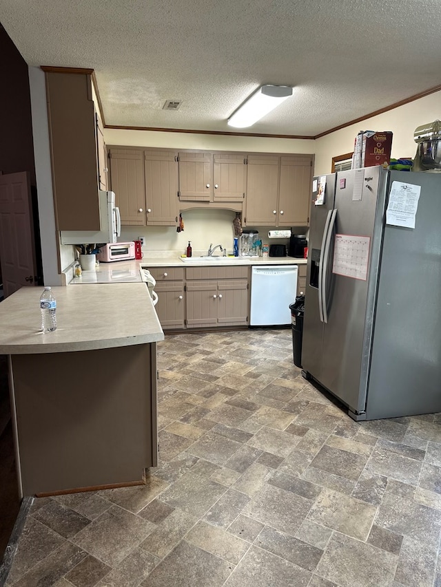 kitchen with dishwasher, light countertops, ornamental molding, stainless steel refrigerator with ice dispenser, and a sink