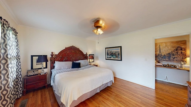 514 S Main St, Headland, AL 36345 - bedroom featuring wood finished floors, ornamental molding, and a ceiling fan