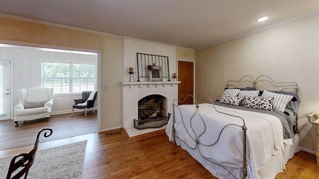 514 S Main St, Headland, AL 36345 - bedroom featuring wood finished floors, ornamental molding, a fireplace, and baseboards