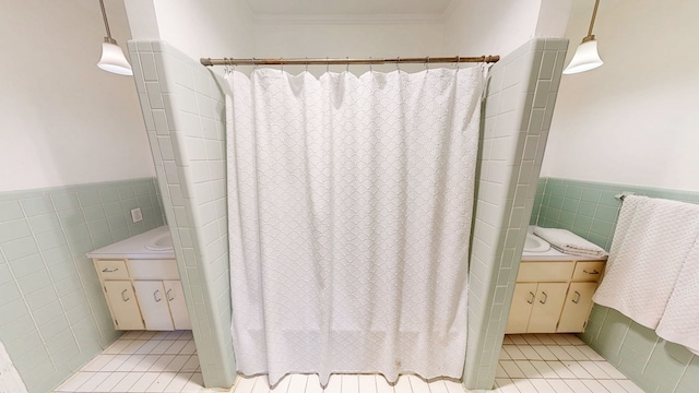 514 S Main St, Headland, AL 36345 - full bath featuring tile walls, vanity, tile patterned flooring, a wainscoted wall, and curtained shower