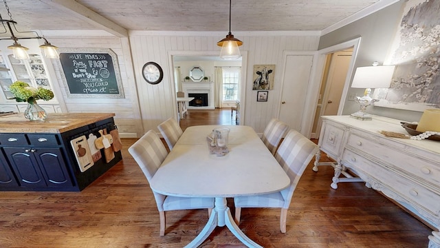 514 S Main St, Headland, AL 36345 - dining room with dark wood-type flooring, crown molding, wooden walls, and a fireplace