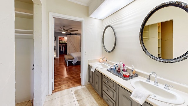 514 S Main St, Headland, AL 36345 - full bath with tile patterned flooring, ceiling fan, double vanity, a walk in closet, and crown molding