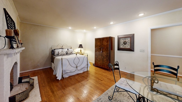 514 S Main St, Headland, AL 36345 - bedroom with wood finished floors, crown molding, baseboards, and recessed lighting