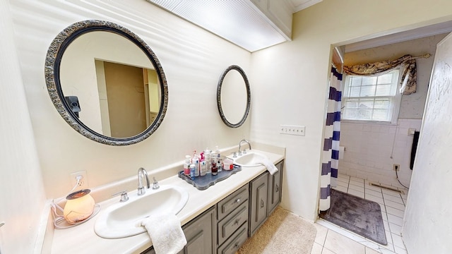 514 S Main St, Headland, AL 36345 - full bathroom featuring tile patterned flooring, double vanity, and tiled shower