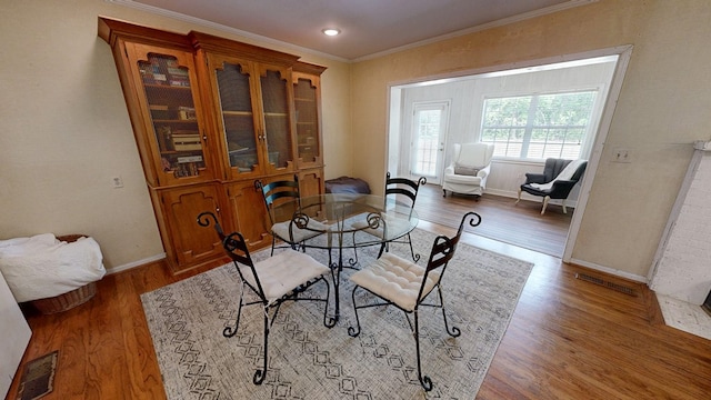 514 S Main St, Headland, AL 36345 - dining area featuring crown molding, baseboards, wood finished floors, and recessed lighting