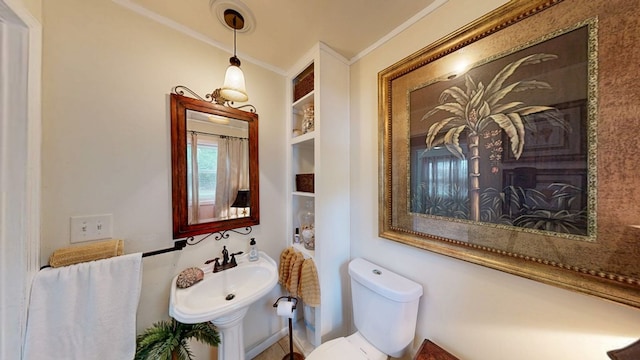 514 S Main St, Headland, AL 36345 - half bath featuring crown molding, toilet, and a sink