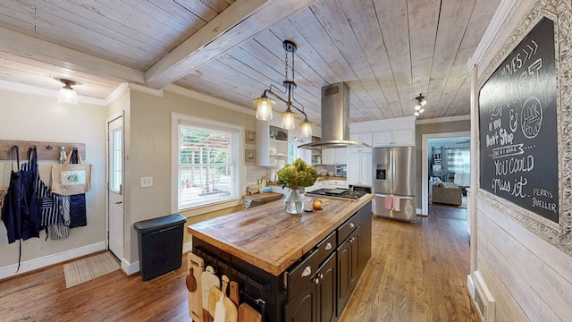514 S Main St, Headland, AL 36345 - kitchen featuring appliances with stainless steel finishes, wooden ceiling, island range hood, wood counters, and wood finished floors