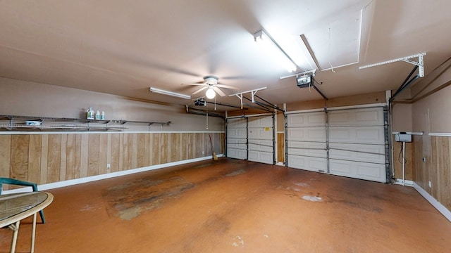 412 Darlington Cir, Dothan, AL 36301 - garage featuring wooden walls, baseboards, and a garage door opener