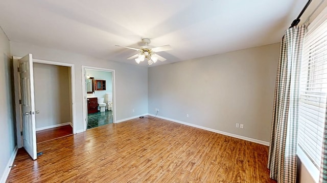 412 Darlington Cir, Dothan, AL 36301 - unfurnished bedroom with light wood-style floors, baseboards, connected bathroom, and ceiling fan