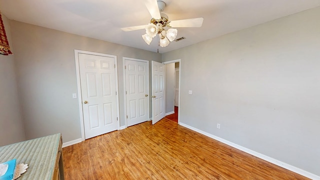 412 Darlington Cir, Dothan, AL 36301 - unfurnished bedroom with baseboards, light wood finished floors, and a ceiling fan