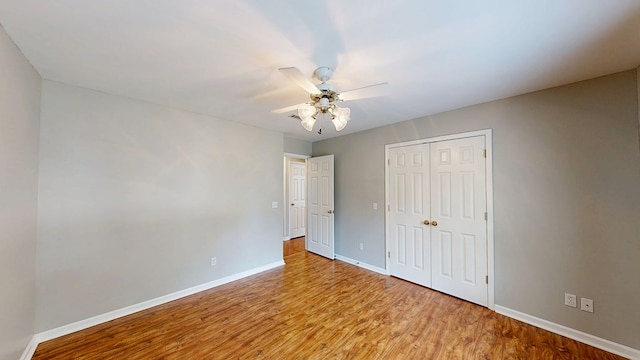 412 Darlington Cir, Dothan, AL 36301 - unfurnished bedroom with baseboards, wood finished floors, a closet, and ceiling fan