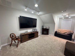 living room with vaulted ceiling and carpet