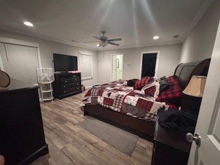 bedroom featuring ceiling fan and wood-type flooring