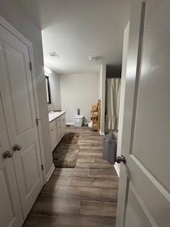 bathroom featuring vanity and wood-type flooring