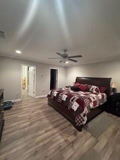 bedroom featuring ceiling fan and light hardwood / wood-style flooring