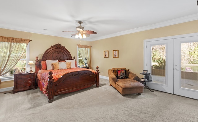 carpeted bedroom featuring access to outside, ceiling fan, french doors, and crown molding