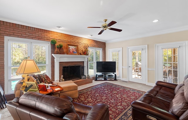 carpeted living room with ornamental molding, a healthy amount of sunlight, and brick wall