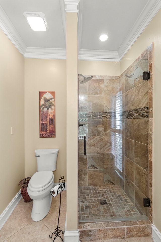 bathroom with tile patterned flooring, toilet, ornamental molding, and walk in shower