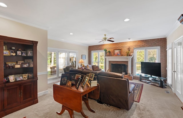 carpeted living room featuring ceiling fan, a wealth of natural light, ornamental molding, and brick wall