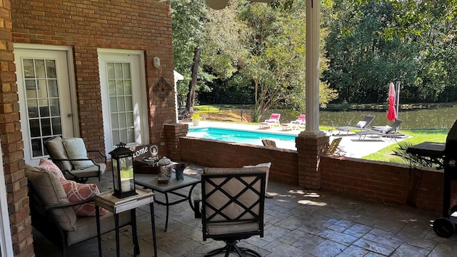 view of patio / terrace featuring a water view