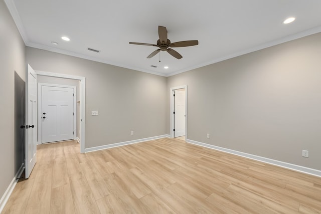 spare room with light hardwood / wood-style flooring, ceiling fan, and ornamental molding