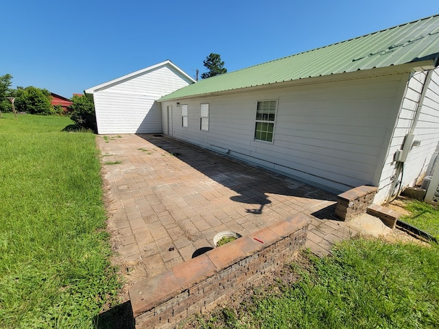 952 Easterling Mill Rd, Ariton, AL 36311 - back of property featuring a patio, a yard, and a metal roof