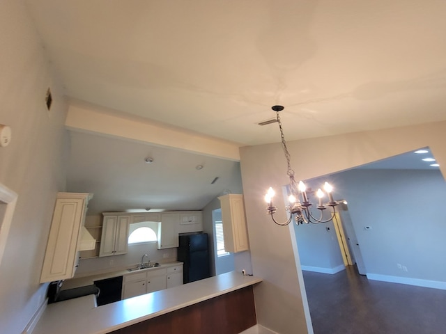 952 Easterling Mill Rd, Ariton, AL 36311 - kitchen featuring freestanding refrigerator, a chandelier, light countertops, and a peninsula