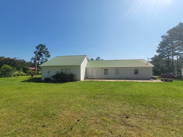 952 Easterling Mill Rd, Ariton, AL 36311 - rear view of house with a lawn and a metal roof