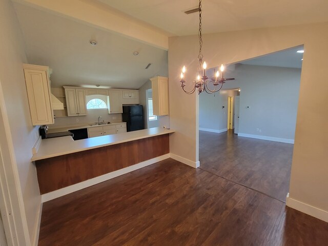 952 Easterling Mill Rd, Ariton, AL 36311 - kitchen featuring freestanding refrigerator, a chandelier, dark wood-type flooring, light countertops, and open floor plan
