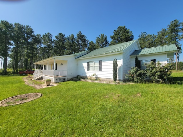 952 Easterling Mill Rd, Ariton, AL 36311 - rear view of house featuring a yard, a porch, and a metal roof