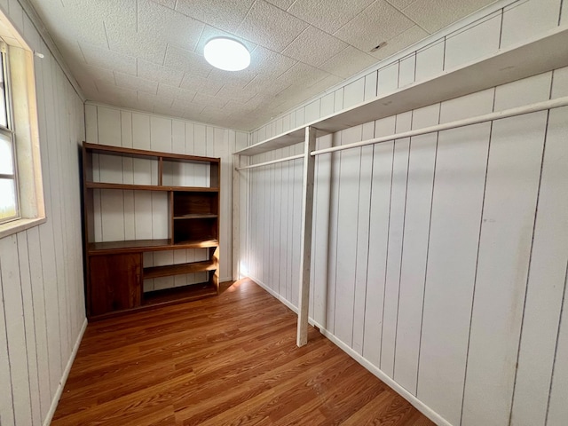 walk in closet featuring wood finished floors