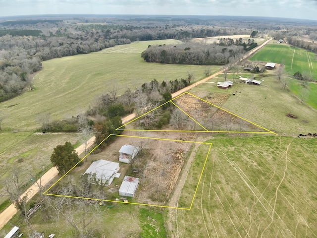 birds eye view of property with a rural view