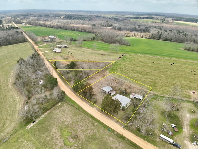 birds eye view of property featuring a rural view