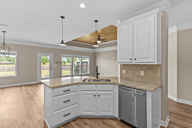 kitchen with light wood-style floors, ornamental molding, a sink, and dishwasher
