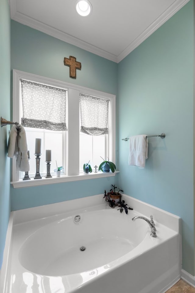 full bath with a garden tub and crown molding