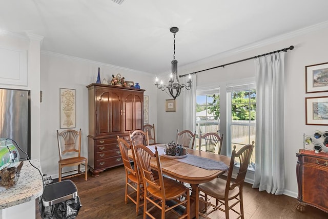 dining room featuring ornamental molding, a notable chandelier, baseboards, and dark wood-style floors