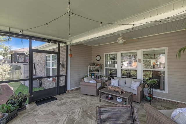 sunroom with a ceiling fan