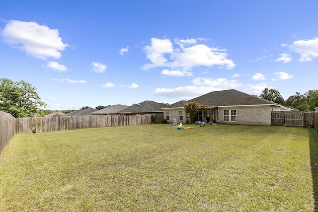 view of yard featuring a fenced backyard
