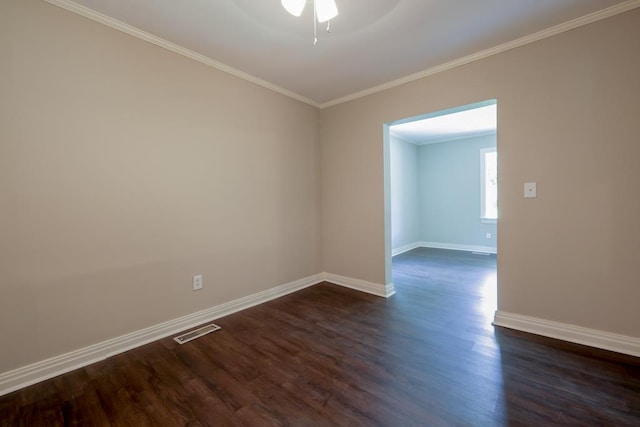 unfurnished room with crown molding, dark hardwood / wood-style flooring, and ceiling fan