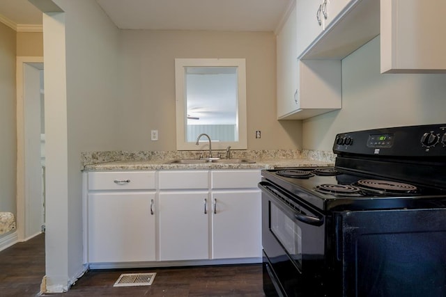 kitchen featuring dark hardwood / wood-style flooring, light stone counters, sink, white cabinets, and black electric range oven