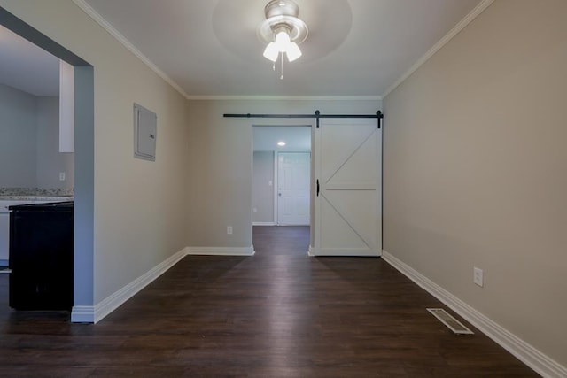 unfurnished room featuring a barn door, crown molding, electric panel, and dark wood-type flooring