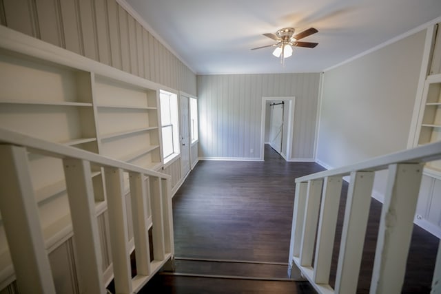 interior space with ceiling fan, wood-type flooring, and ornamental molding