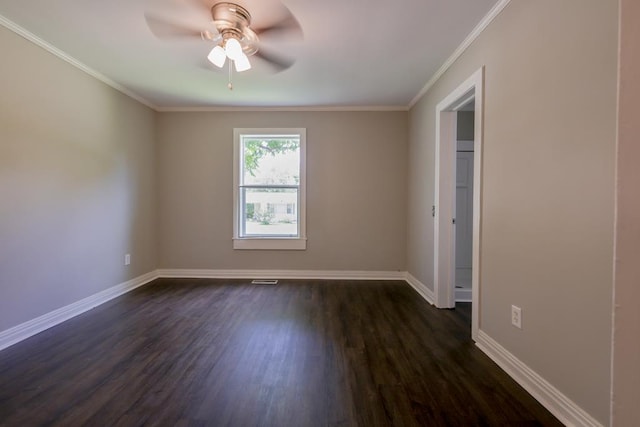 empty room with ceiling fan, dark hardwood / wood-style floors, and ornamental molding