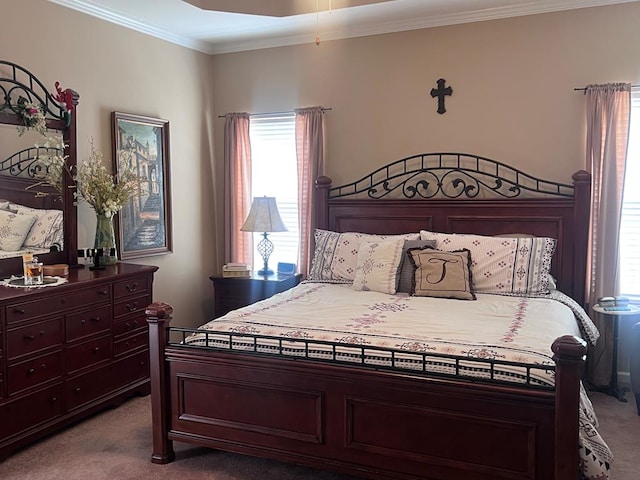 bedroom featuring dark colored carpet, multiple windows, and crown molding