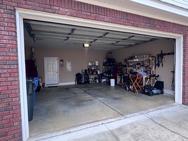 garage featuring electric panel and a garage door opener