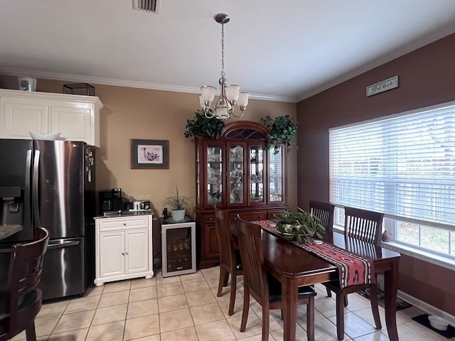 dining area with wine cooler, crown molding, light tile patterned floors, visible vents, and a chandelier