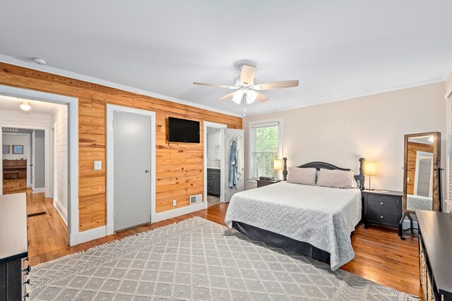 702 W Lee St, Enterprise, AL 36330 - bedroom featuring ornamental molding, wood finished floors, ceiling fan, and ensuite bathroom